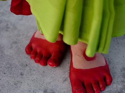Close-up of a person's feet in a steady standing pose.